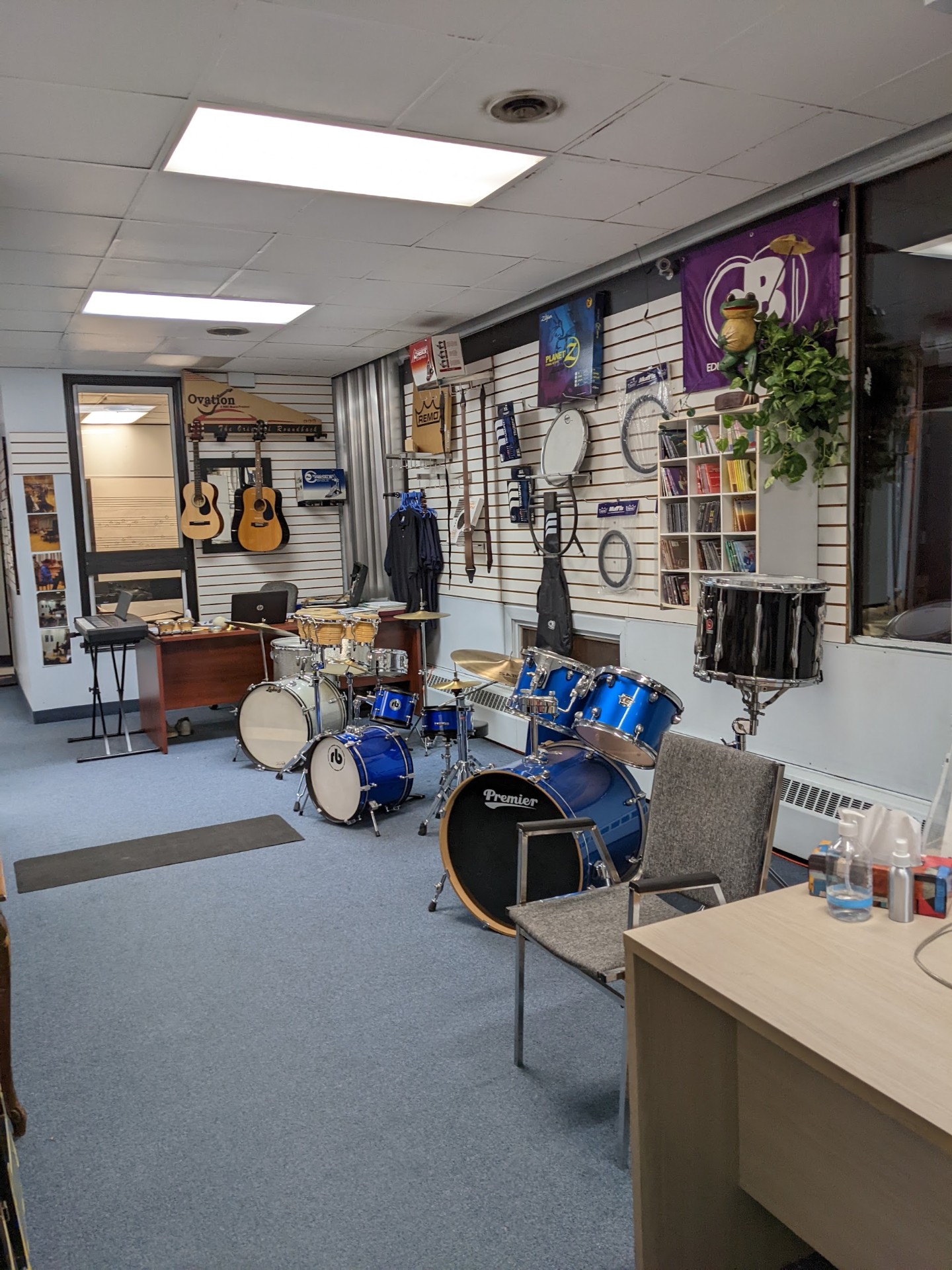 Main showroom with drums, guitars and gear